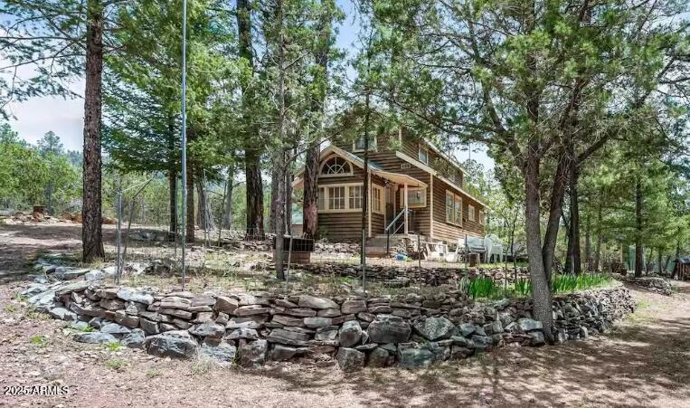 259 South Morris Meadows Payson, AZ 85541 - Photo 14 of 33 a front view of a house with trees