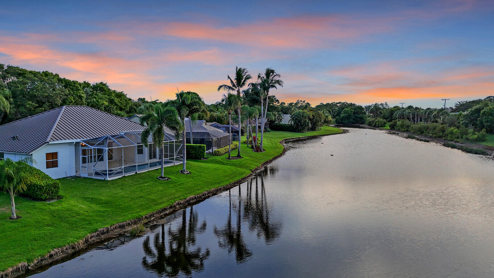 6845 Big Cypress Drive Jupiter, FL 33458 - Photo 59 of 66 76_Twilight_Aerial_4_mls