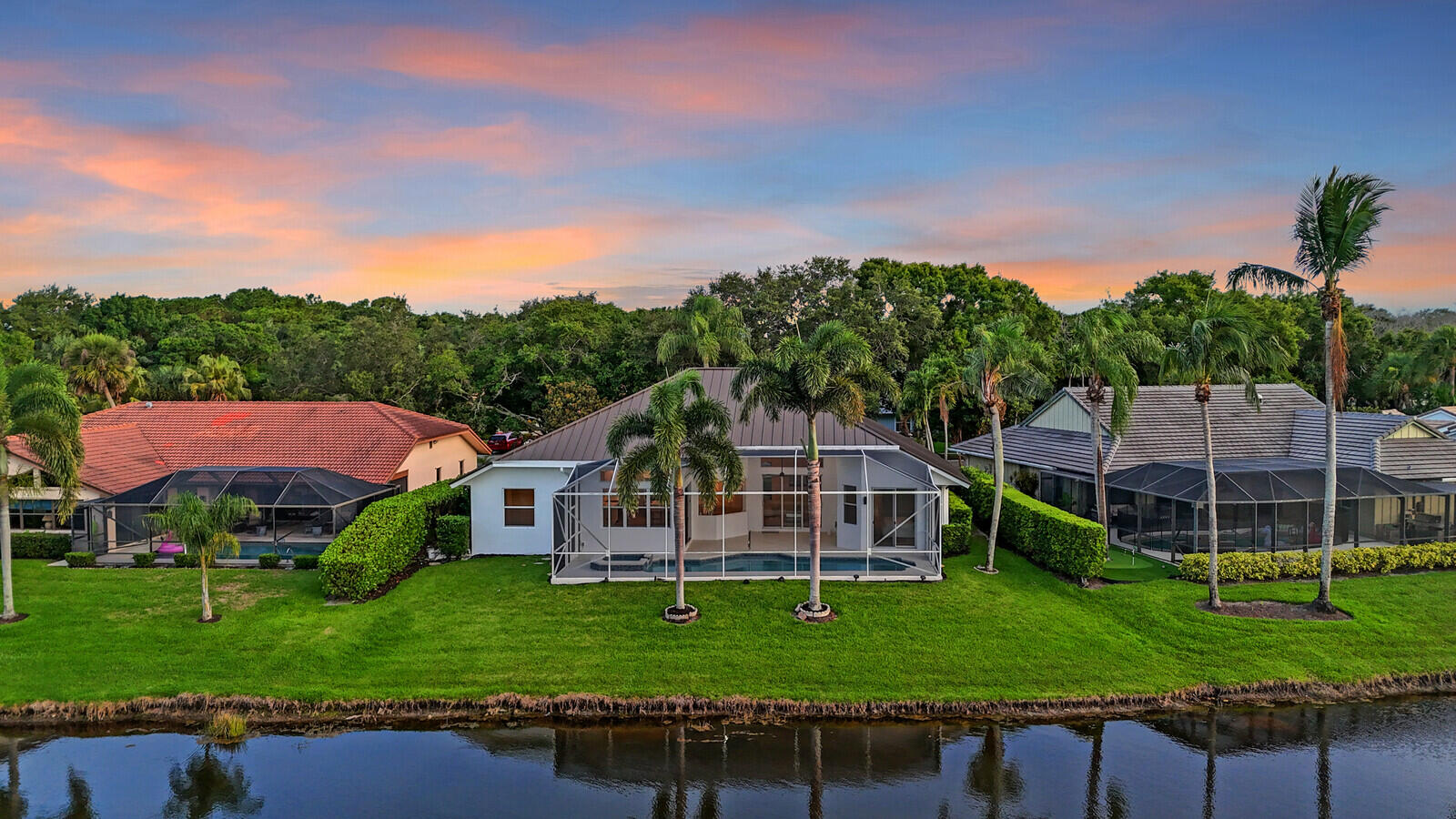 6845 Big Cypress Drive Jupiter, FL 33458 - Photo 62 of 66 75_Twilight_Aerial_3_mls