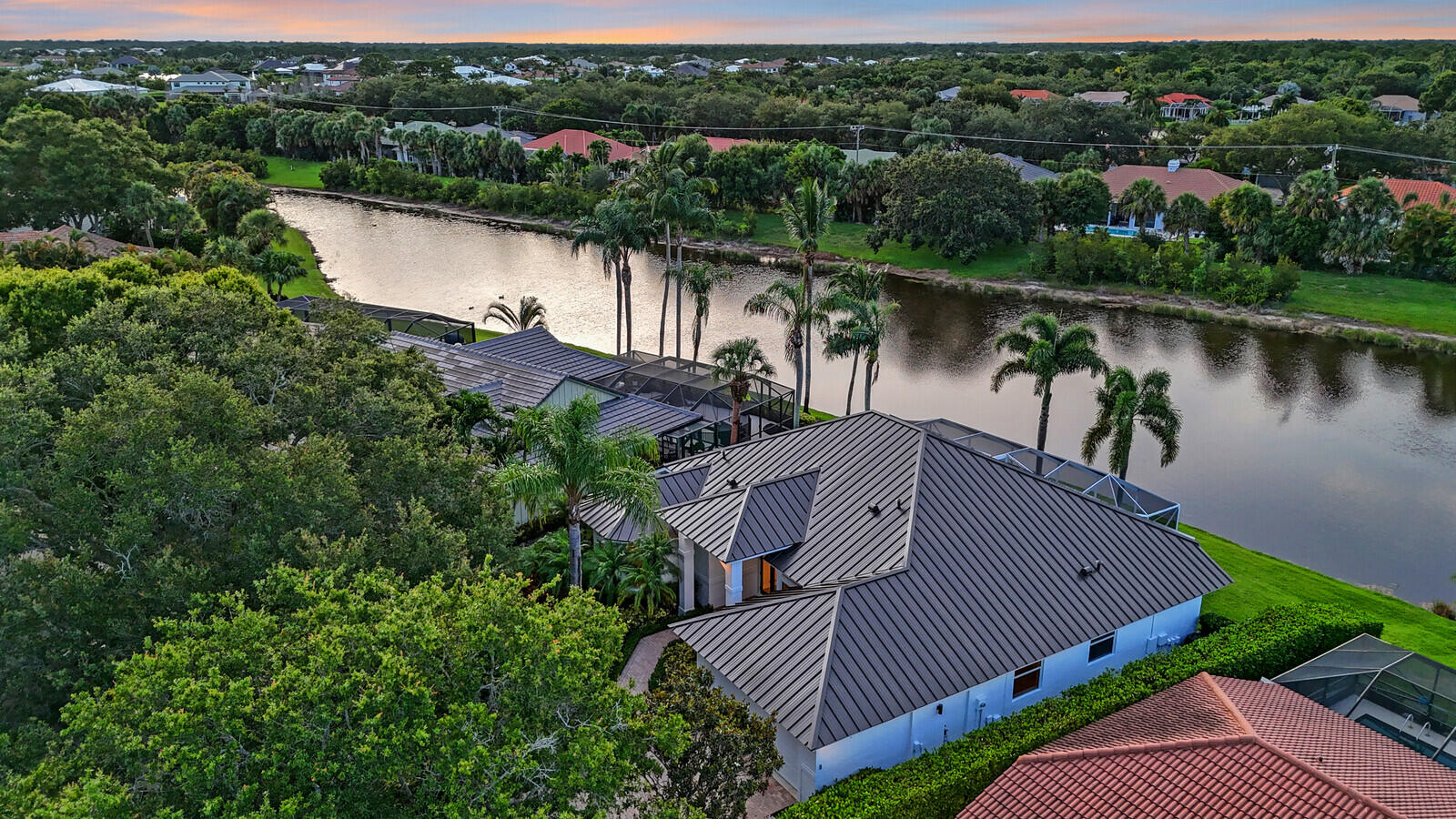 6845 Big Cypress Drive Jupiter, FL 33458 - Photo 63 of 66 79_Twilight_aerial_7_mls
