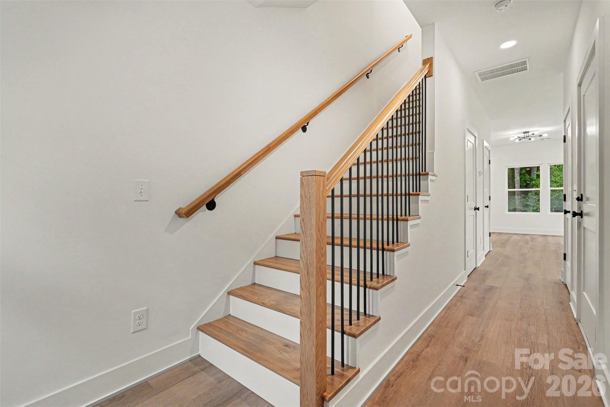 7521 Lawyers Road Charlotte, NC 28227 - Photo 10 of 35 a view of a hallway with staircase