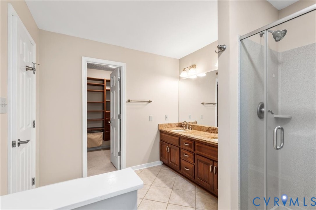1437 Palmore Road Powhatan, VA 23139 - Photo 33 of 60 Bathroom featuring a dual vanity with a stone coun