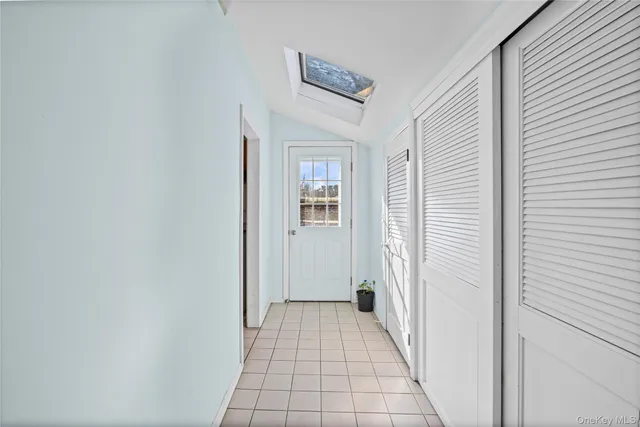 a view of a hallway with a white walls