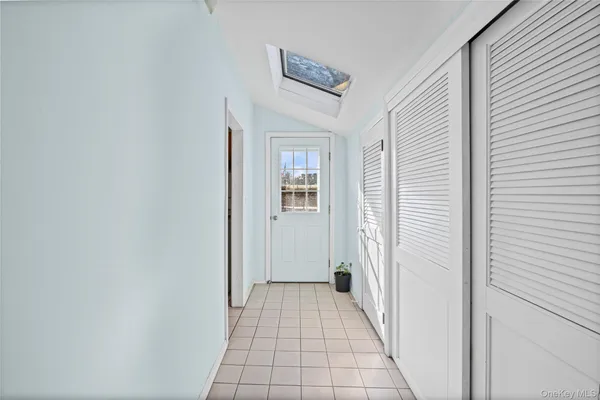 a view of a hallway with a white walls