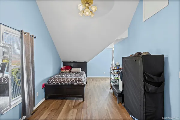 a bedroom with a bed and a closet