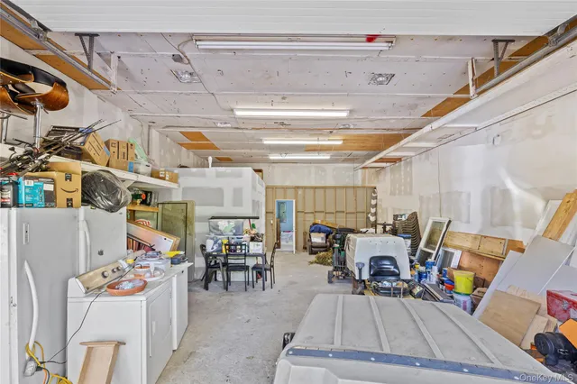 a view of a garage with a table and chairs