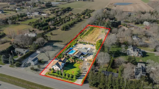 an aerial view of a house with a yard