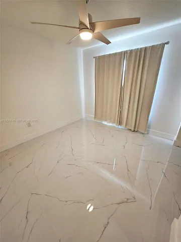 a bathroom with a sink a toilet and a shower