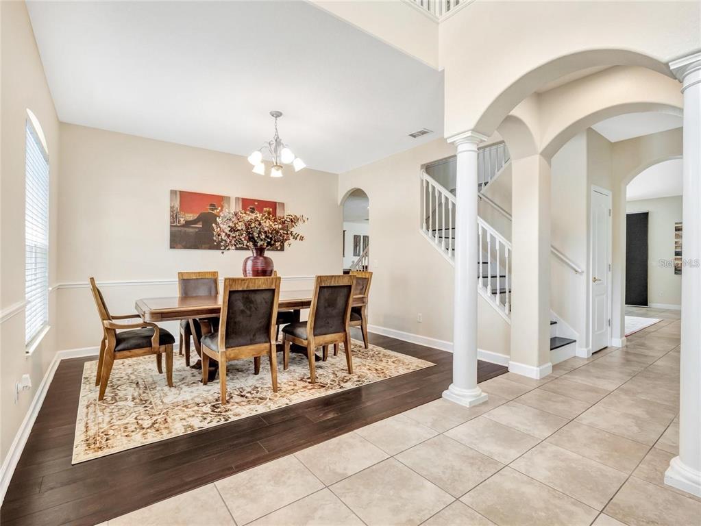 10023 Ians Ridge Road Orlando, FL 32832 - Photo 7 of 60 a view of a dining room with furniture