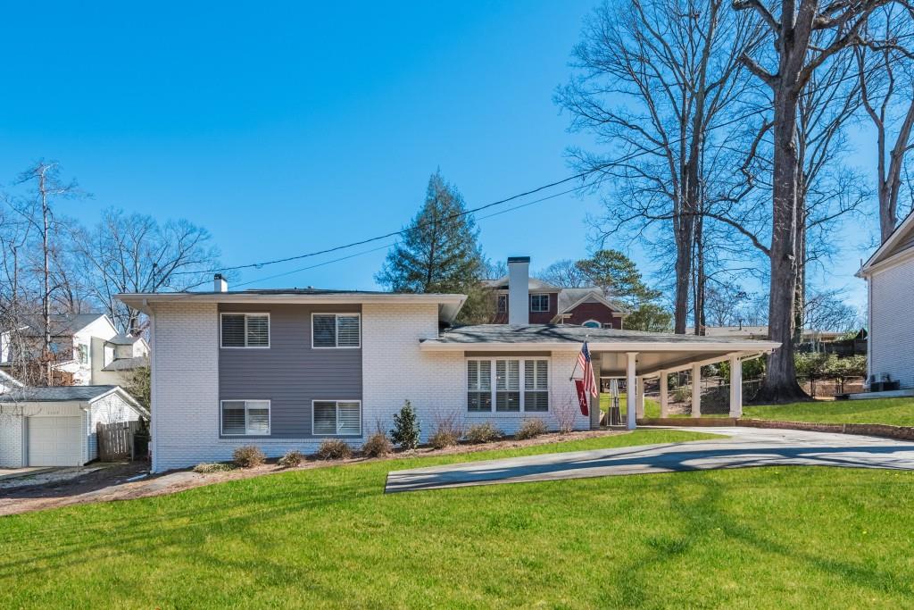 3635 Fortingale Road Atlanta, GA 30341 - Photo 1 of 1 a front view of house with yard and green space