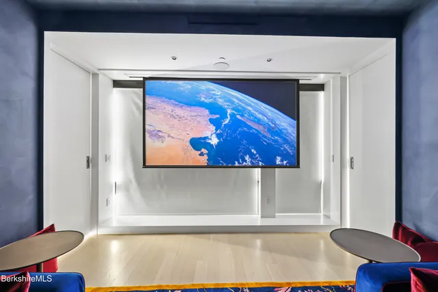 a room with lots of furniture and a window