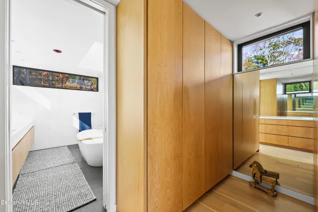 a bathroom with a sink mirror and a bath tub
