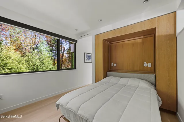 a spacious bathroom with a sink and a mirror