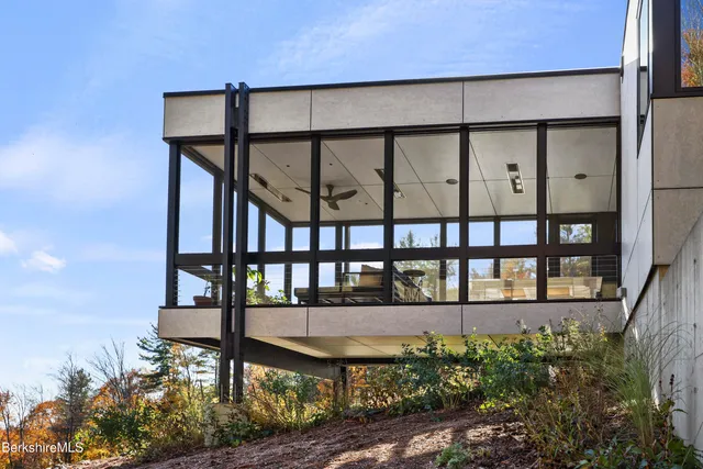 a kitchen with a sink and wooden floor