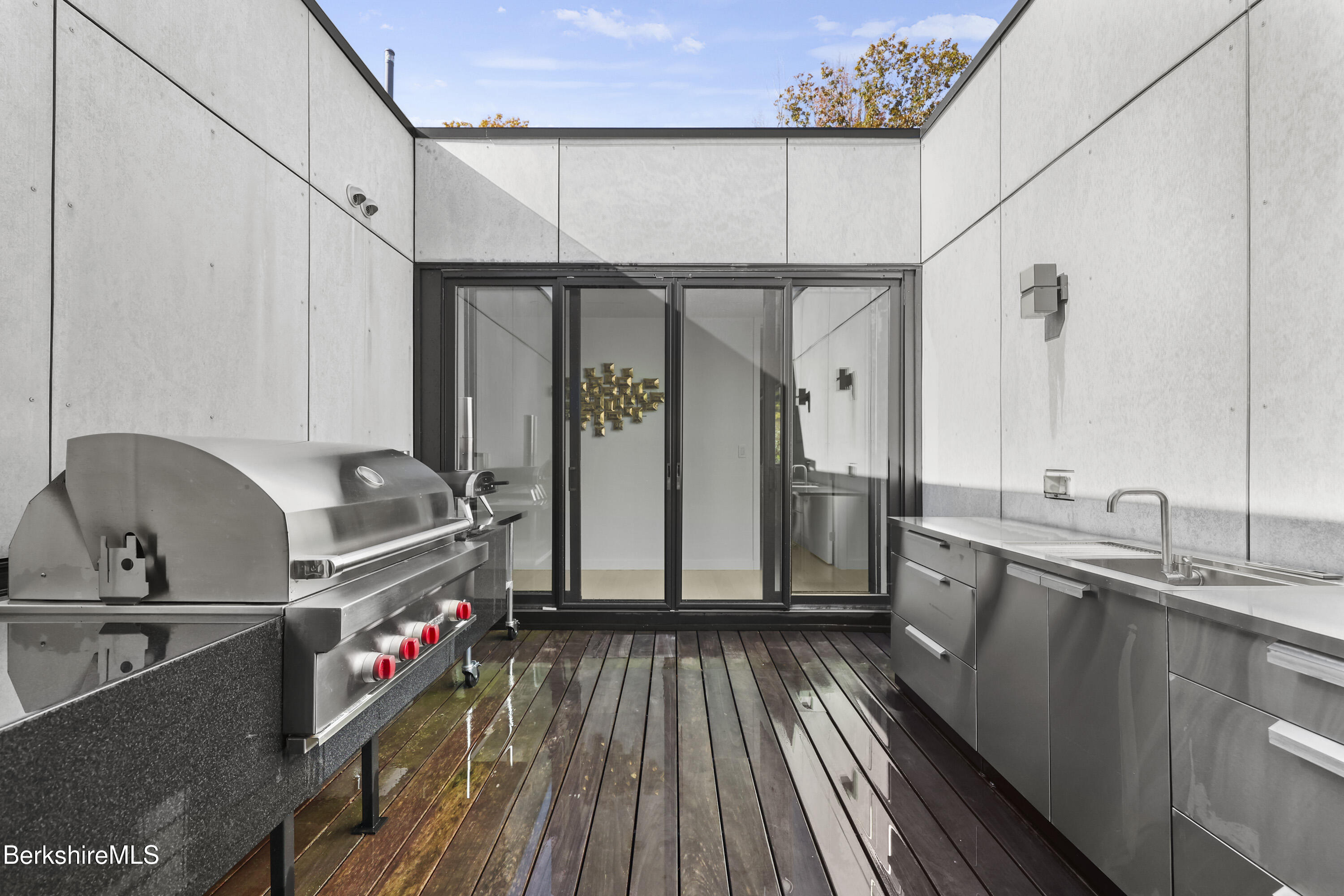 42 West Alford Road West Stockbridge, MA 01266 - Photo 28 of 35 a kitchen with kitchen island granite countertop a sink and wooden floor