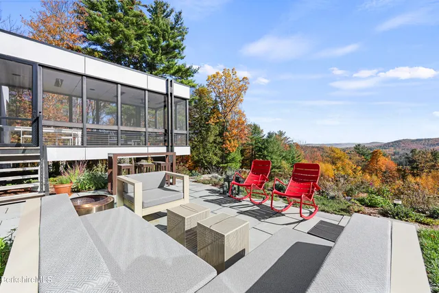 an aerial view of a house with a garden