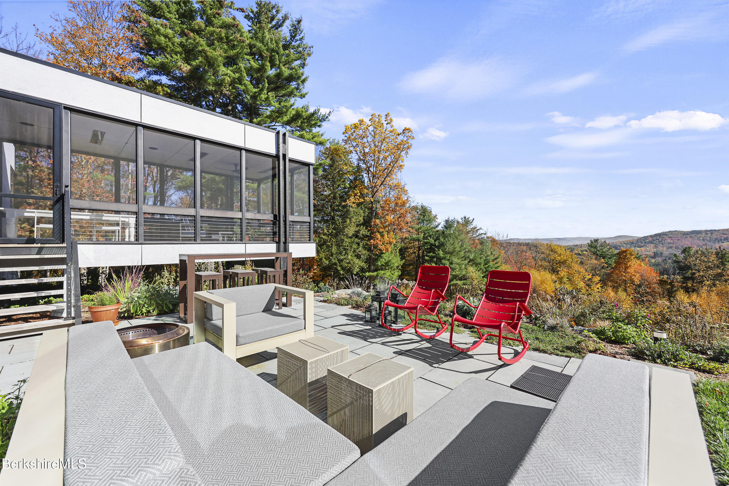42 West Alford Road West Stockbridge, MA 01266 - Photo 32 of 35 a view of a patio with couches and table and chairs with wooden fence