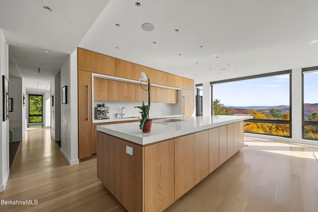 a view of a kitchen with a sink and stove