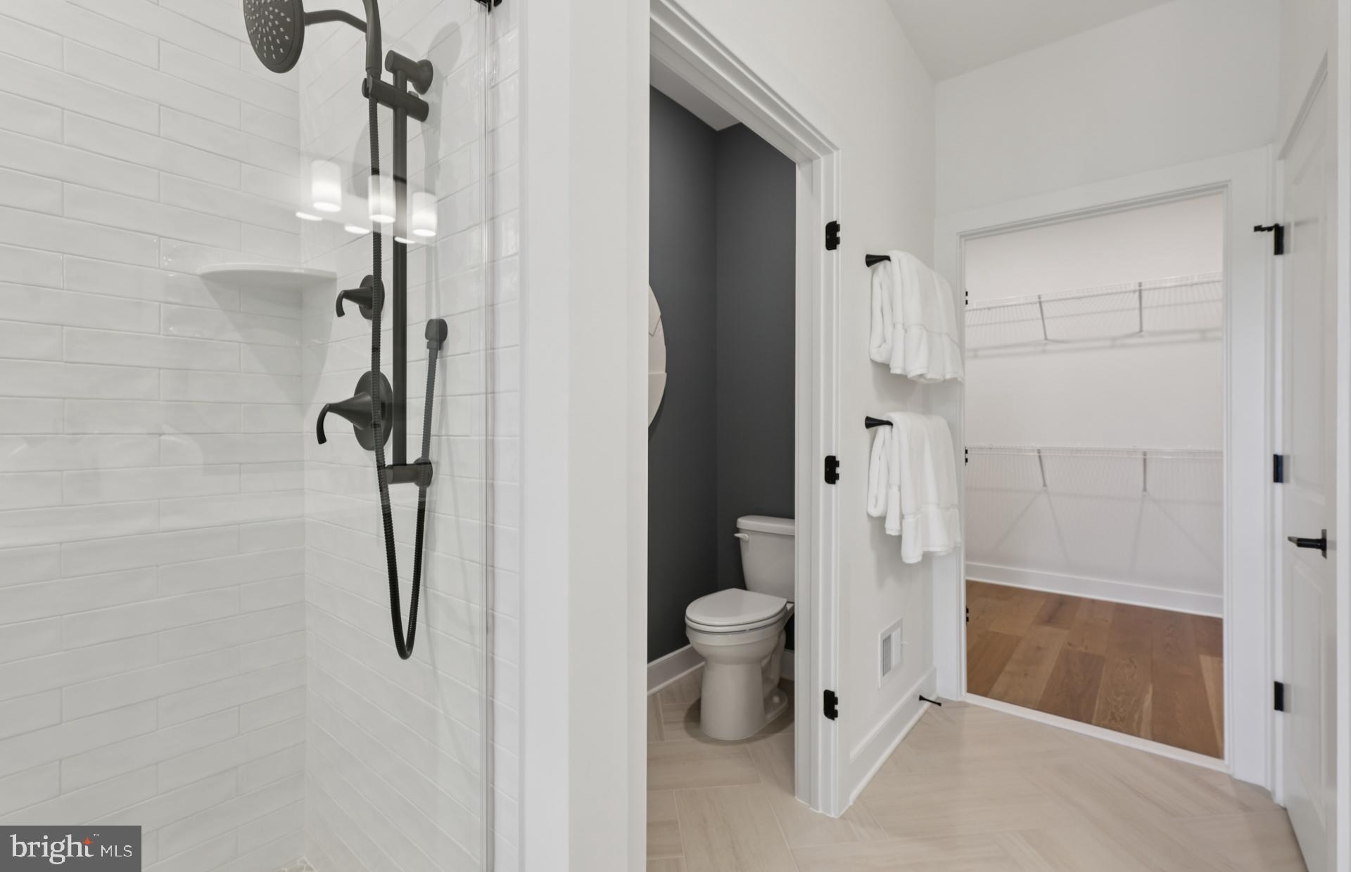 6152 Amber Lane, Unit 2 Haymarket, VA 20169 - Photo 17 of 57 a bathroom with a shower and toilet