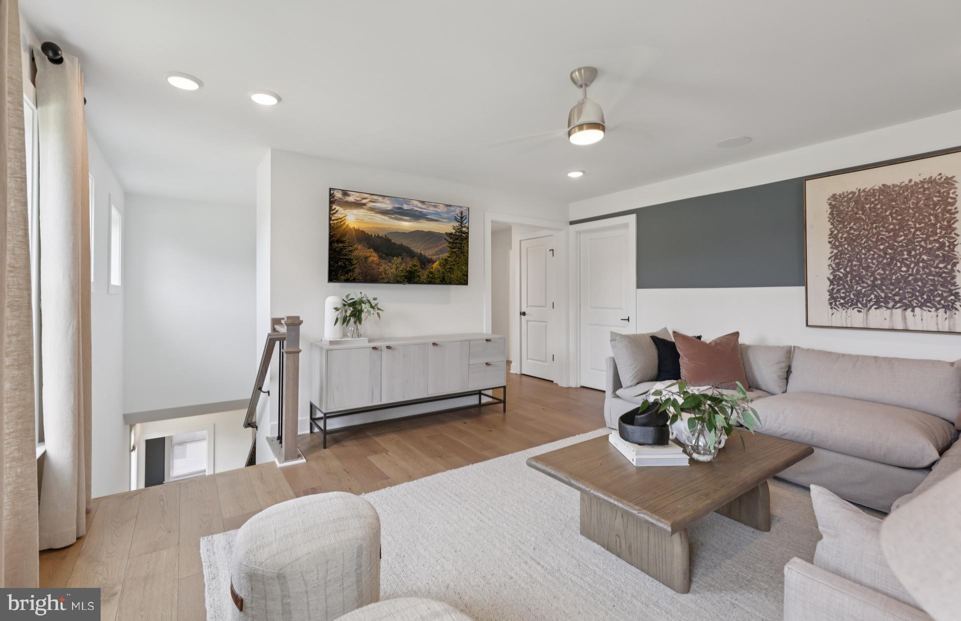 6152 Amber Lane, Unit 2 Haymarket, VA 20169 - Photo 22 of 57 a living room with furniture and a flat screen tv