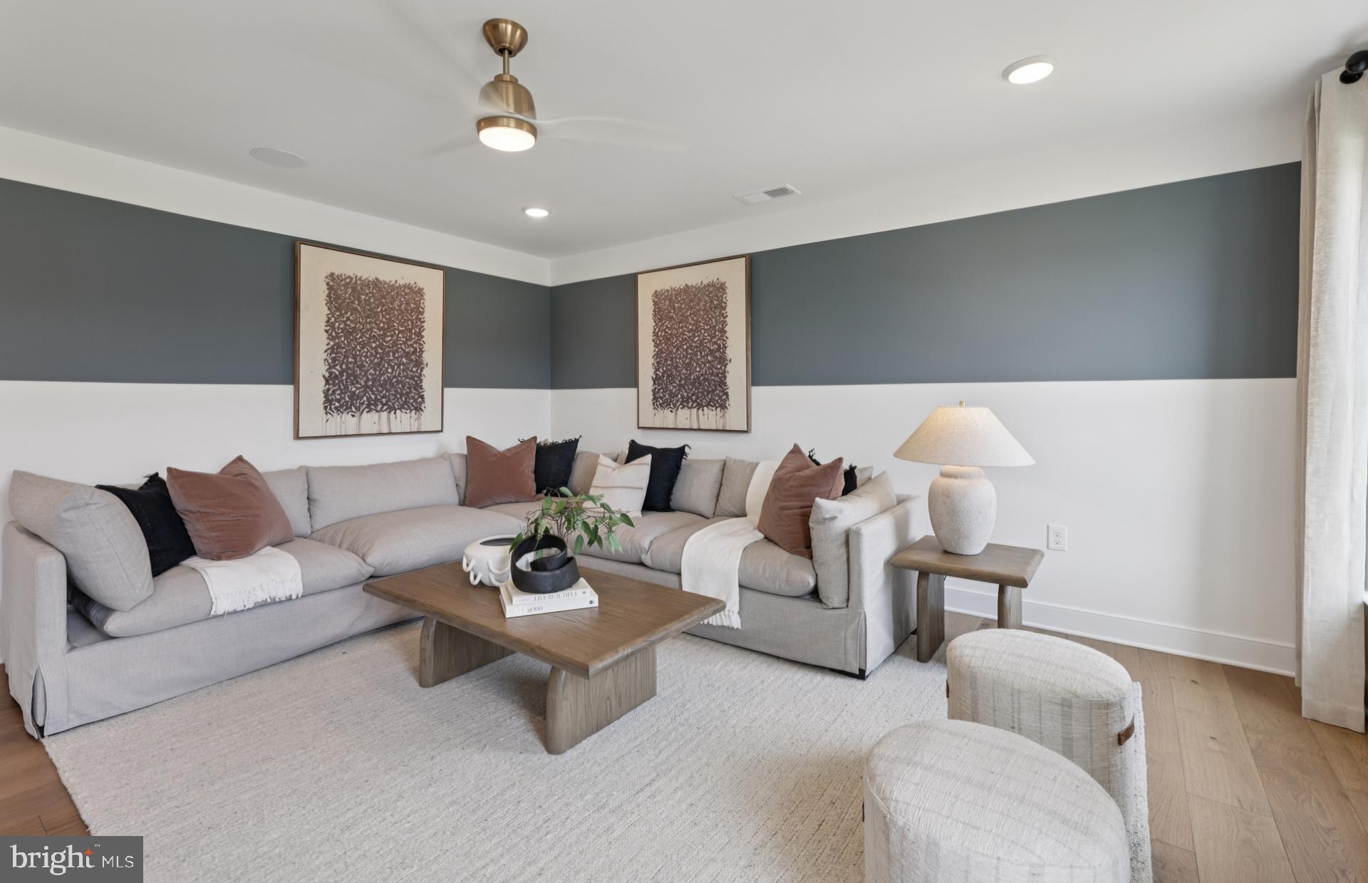 6152 Amber Lane, Unit 2 Haymarket, VA 20169 - Photo 24 of 57 a living room with furniture and wooden floor