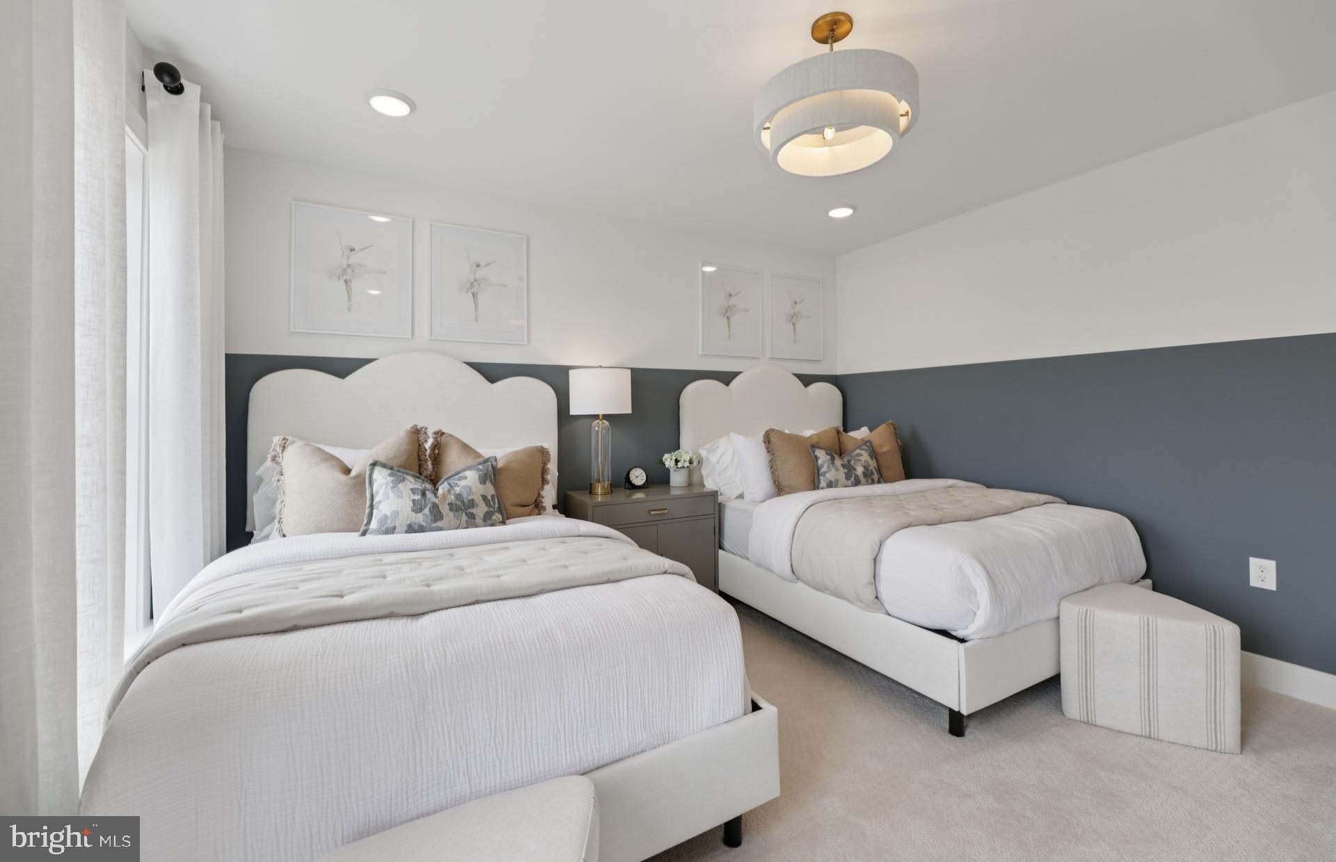 6152 Amber Lane, Unit 2 Haymarket, VA 20169 - Photo 25 of 57 a bedroom with two beds and painting on the wall