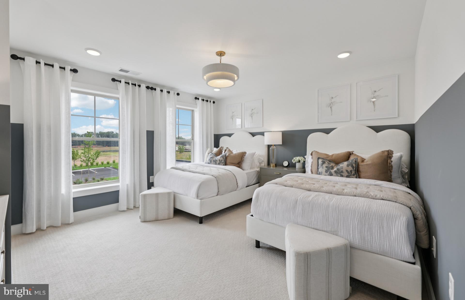 6152 Amber Lane, Unit 2 Haymarket, VA 20169 - Photo 26 of 57 a spacious bedroom with two beds and painted walls