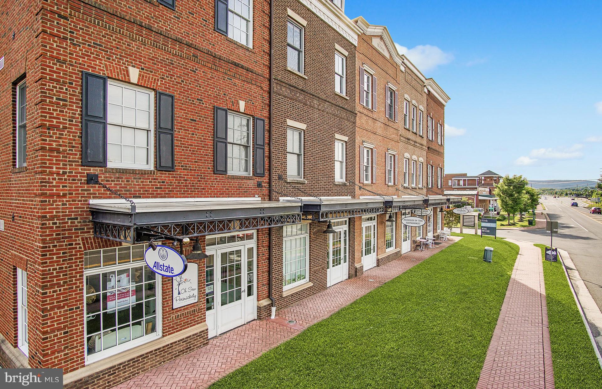 6152 Amber Lane, Unit 2 Haymarket, VA 20169 - Photo 50 of 57 a view of a building with a yard
