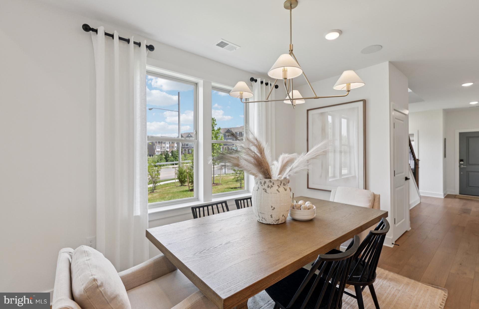 6152 Amber Lane, Unit 2 Haymarket, VA 20169 - Photo 8 of 57 a view of a dining room with furniture window and outside view