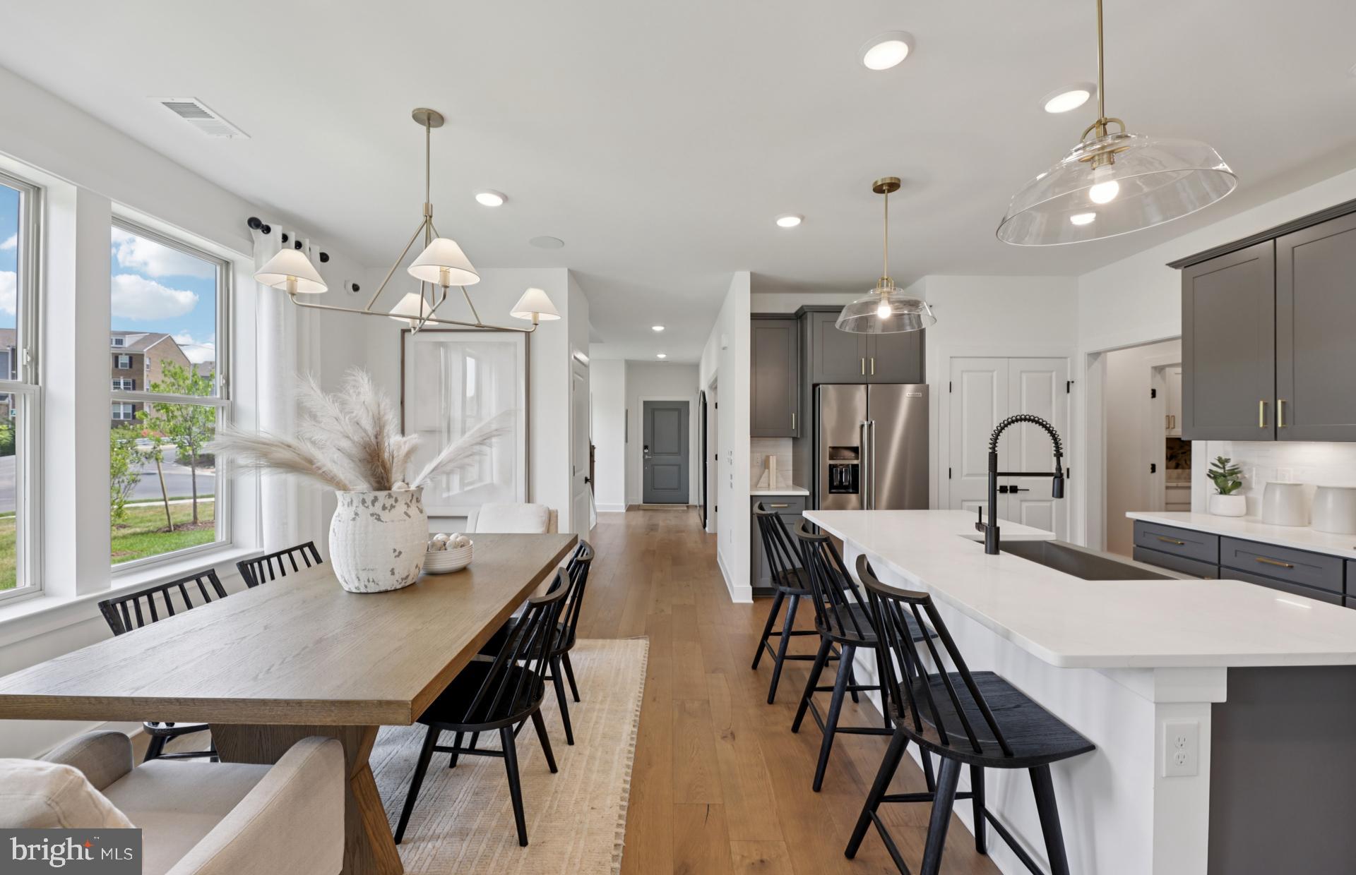6152 Amber Lane, Unit 2 Haymarket, VA 20169 - Photo 57 of 57 a view of a dining room with furniture and a chandelier