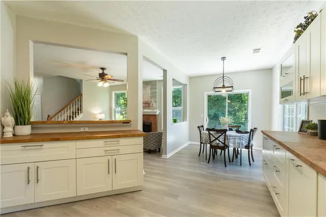 a view of living room with granite countertop furniture and fireplace