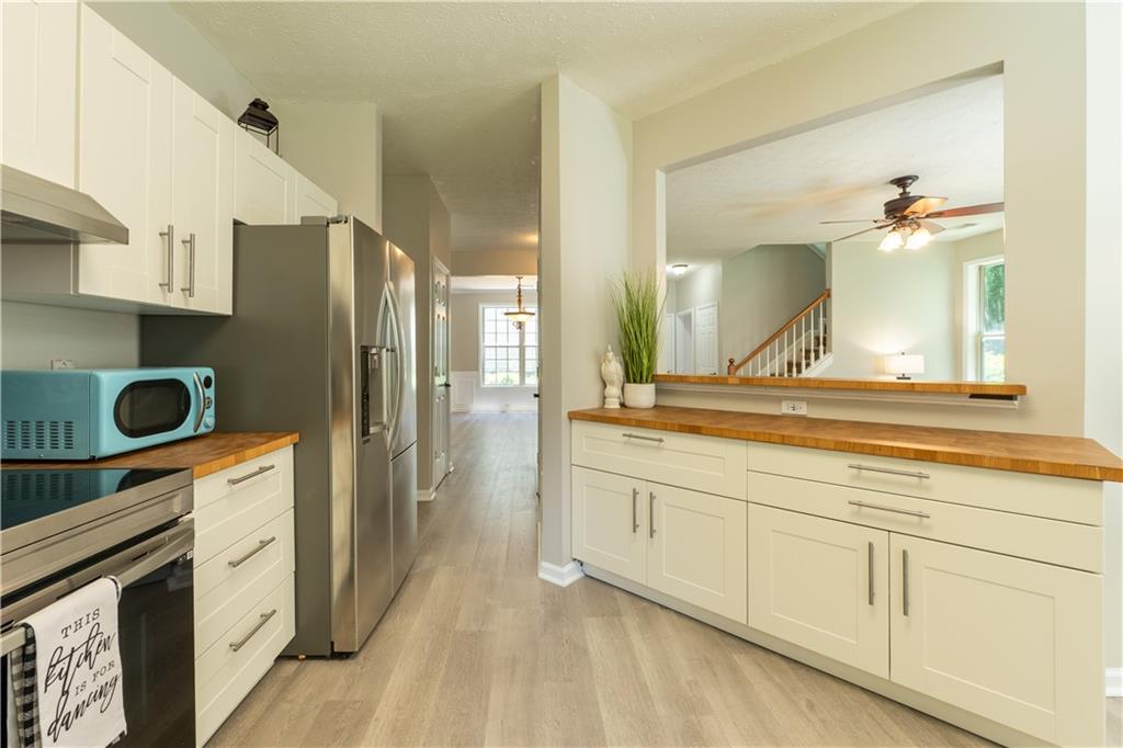 2238 St Albans Place Buford, GA 30519 - Photo 18 of 56 a spacious bathroom with a granite countertop double vanity sink and a mirror