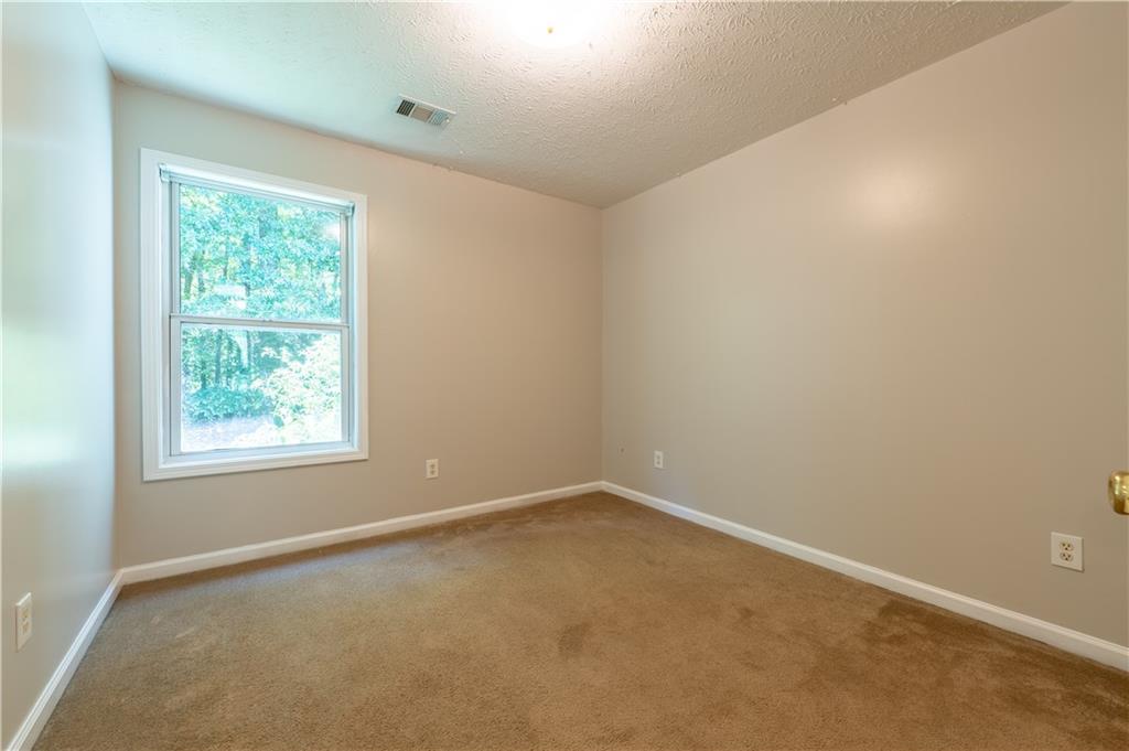 2238 St Albans Place Buford, GA 30519 - Photo 29 of 56 an empty room with a window