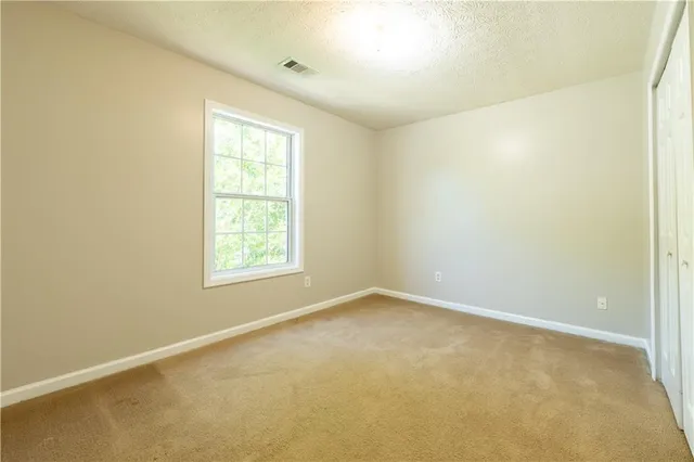 a view of a hallway with windows