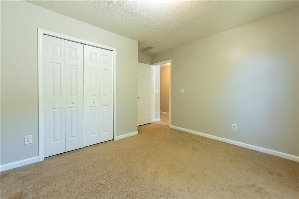 2238 St Albans Place Buford, GA 30519 - Photo 33 of 56 an empty room with closet area