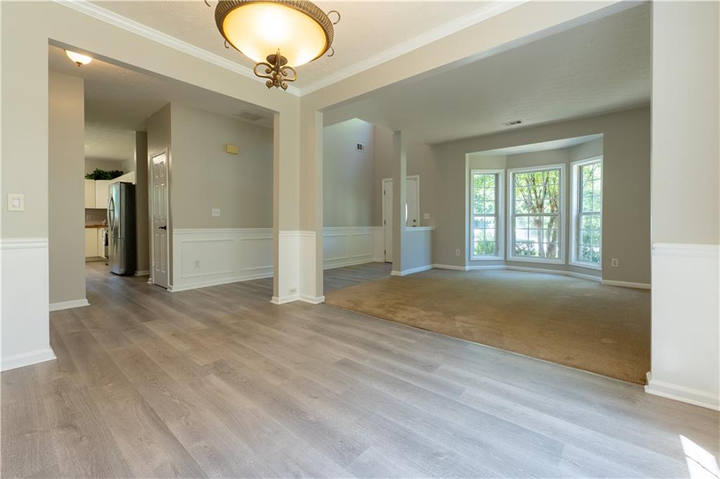 2238 St Albans Place Buford, GA 30519 - Photo 4 of 56 a view of livingroom with natural light