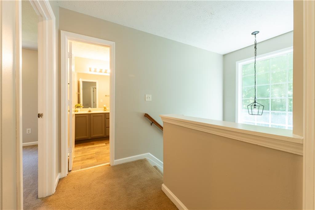2238 St Albans Place Buford, GA 30519 - Photo 43 of 56 a view of hallway with sink and a window