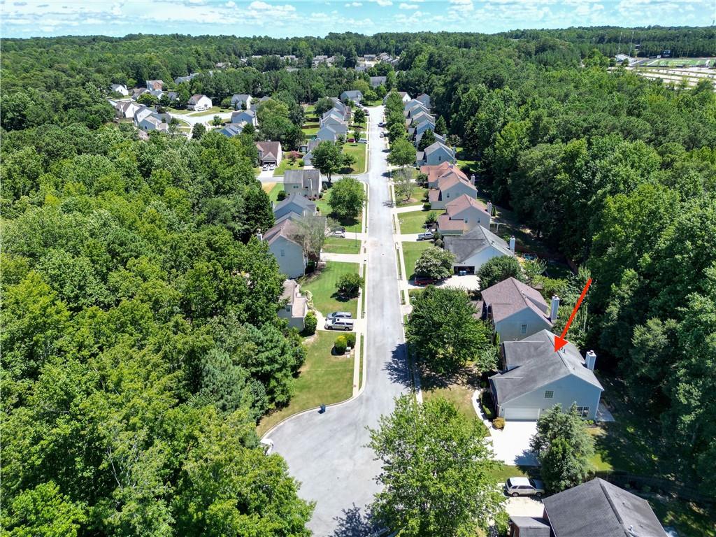 2238 St Albans Place Buford, GA 30519 - Photo 49 of 56 an aerial view of residential houses with outdoor space and trees all around