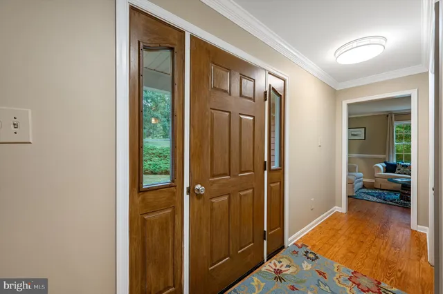 a balcony with furniture and wooden floor