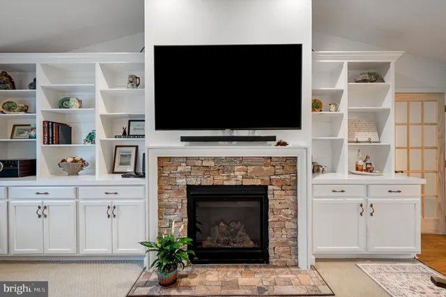 a view of a dining room with furniture and a potted plant