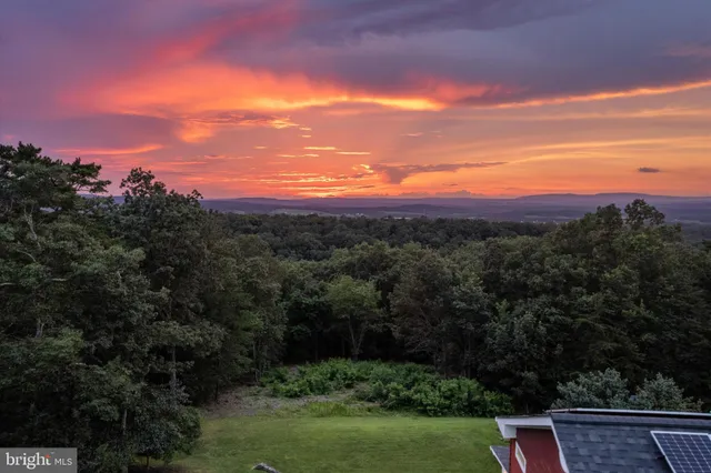 a view of outdoor space with wooden fence