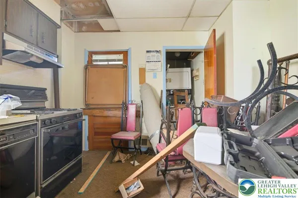 a kitchen with a sink cabinets and window