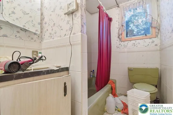 a view of hallway with livingroom and furniture