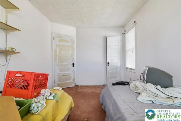 a room with furniture and air hockey table