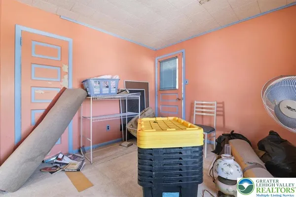 a bathroom with a granite countertop sink and a shower