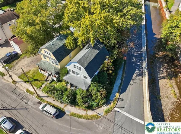 an aerial view of residential houses with outdoor space