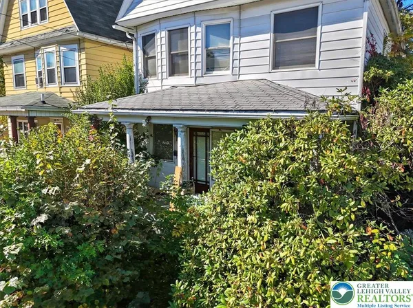 front view of a house with a small yard