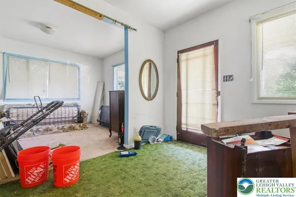 a bedroom with bed and a window