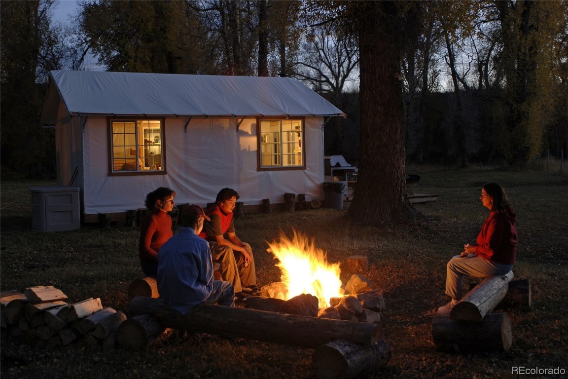 41700 Marabou Loop Steamboat Springs, CO 80487 - Photo 25 of 28 a group of people sitting in a backyard