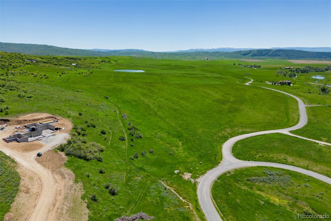 41700 Marabou Loop Steamboat Springs, CO 80487 - Photo 5 of 28 a view of a swimming pool with a garden